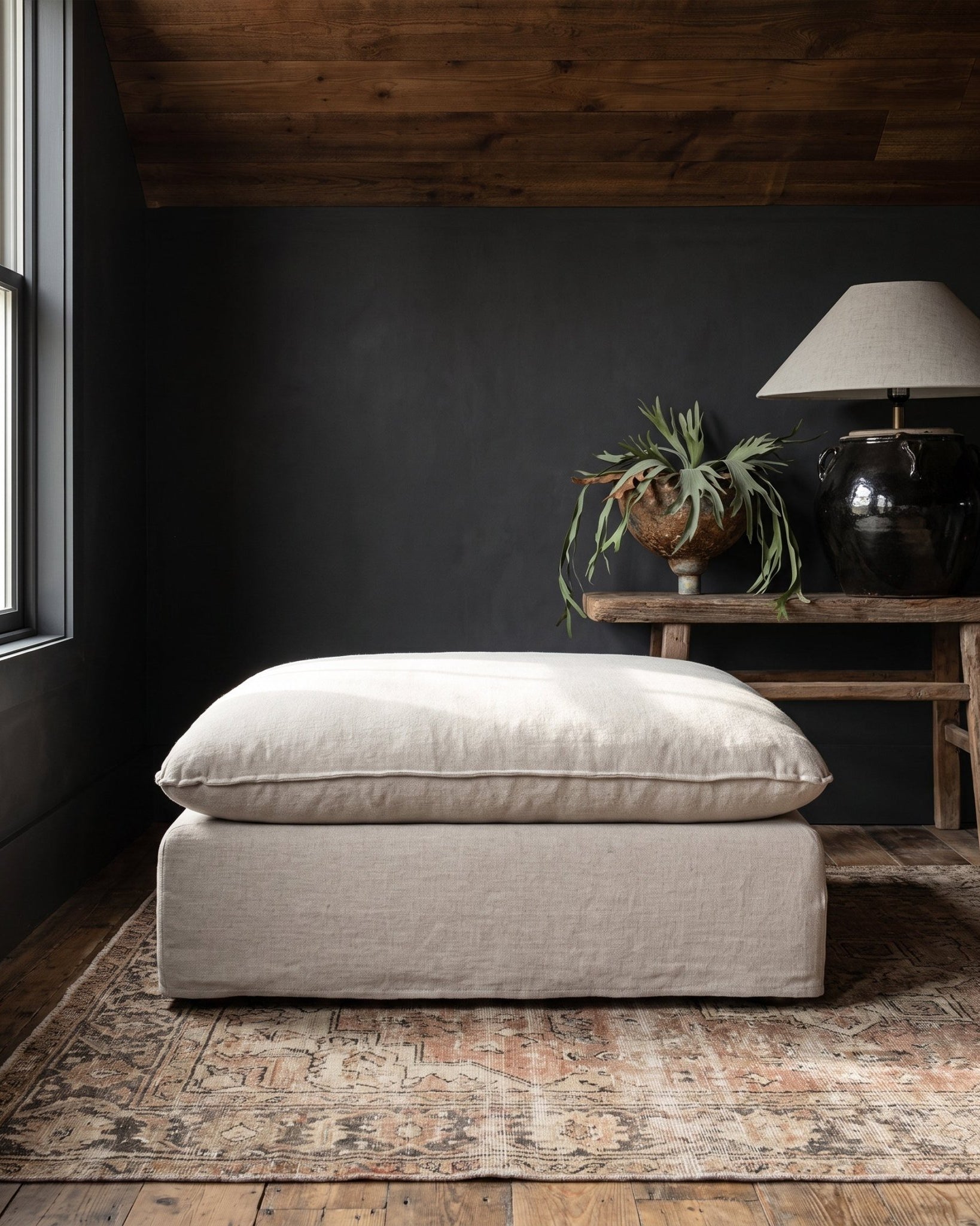 modern mountain Berit Ottoman Hello Norden, shown in a rustic modern room