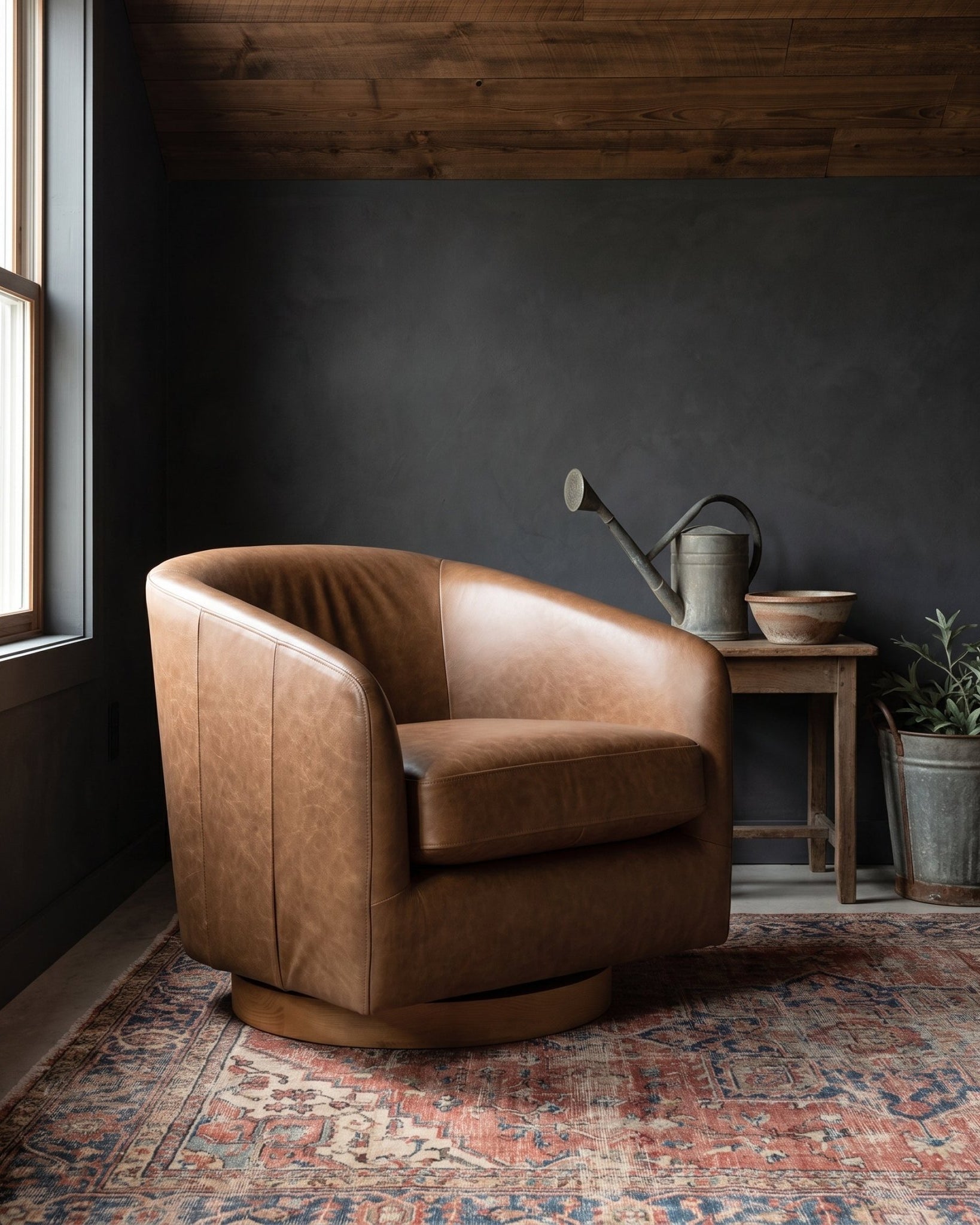 modern mountain Eeva Leather Swivel Chair Hello Norden, shown in a rustic modern room