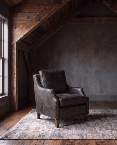 living room custom furniture modern mountain leather chair Hello Norden - Hunter Chair in Run Wyld Ruins leather, shown in a rustic modern room