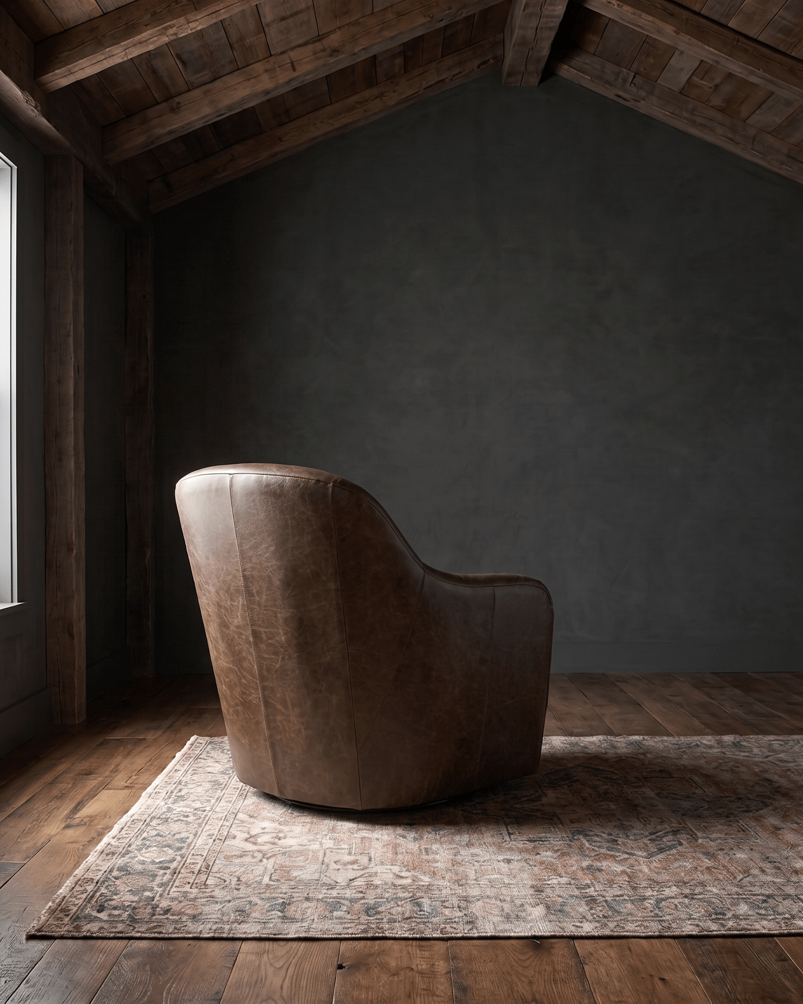 living room custom furniture modern mountain leather chair Hello Norden - Signe Swivel Chair in St Croix Holm Sweet Holm leather, shown in a rustic modern room