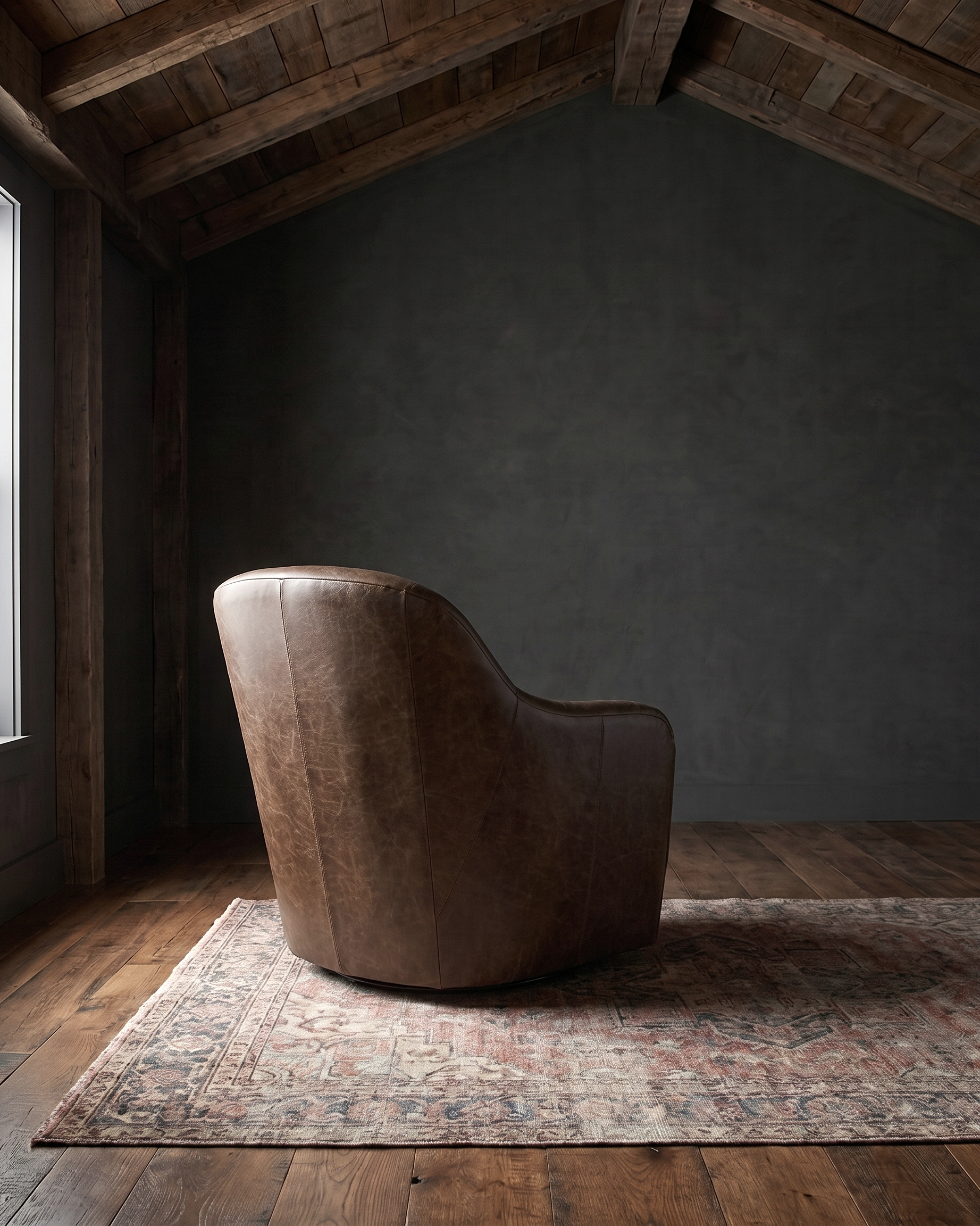 living room custom furniture modern mountain leather chair Hello Norden - Signe Swivel Chair in St Croix Holm Sweet Holm leather, shown in a rustic modern room
