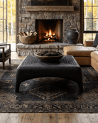 living room modern mountain carved wood coffee table Hello Norden - Alvhild Coffee Table, shown in a rustic modern room, close-up