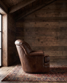 living room custom furniture modern mountain leather chair Hello Norden - Astrid Swivel Chair in St Croix Holm Sweet Holm leather, shown in a rustic modern room