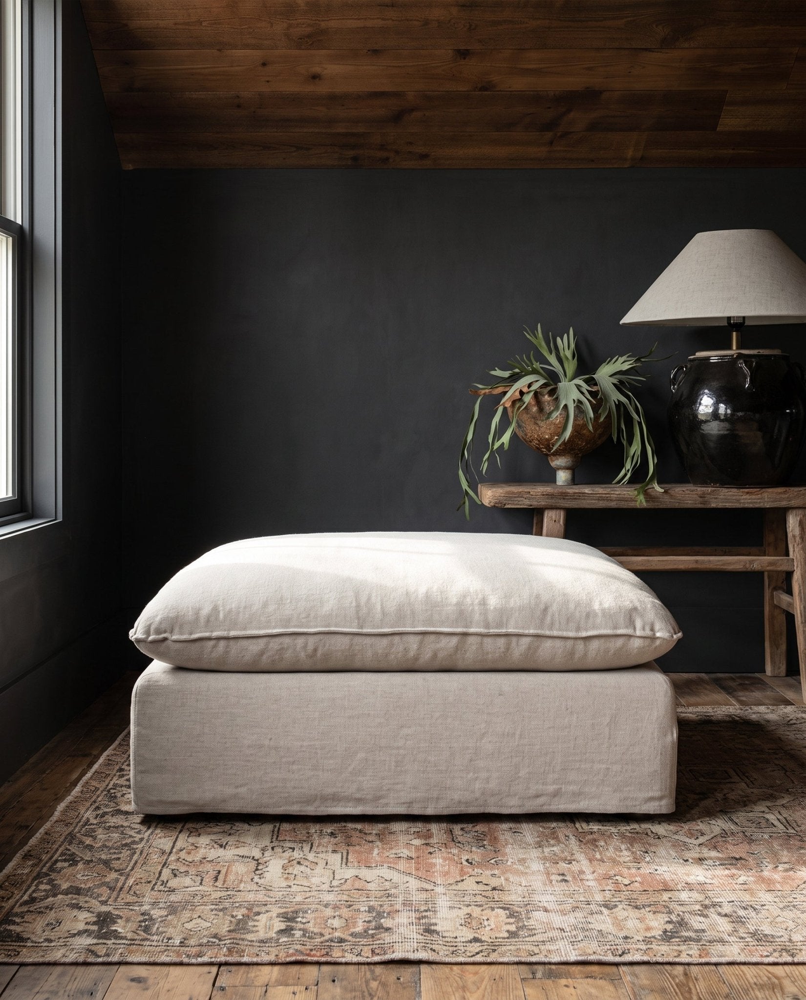 modern mountain Berit Ottoman Hello Norden, shown in a rustic modern room