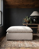 modern mountain Berit Ottoman Hello Norden, shown in a rustic modern room