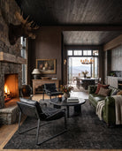 modern mountain Fenris Leather Chesterfield Sofa Hello Norden, shown in a rustic modern room