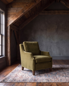 living room custom furniture modern mountain velvet chair Hello Norden - Hunter Chair in Banks Eco-Performance Velvet in Olive, shown in a rustic modern room