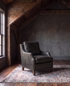 living room custom furniture modern mountain leather chair Hello Norden - Hunter Chair in Run Wyld Ruins leather, shown in a rustic modern room
