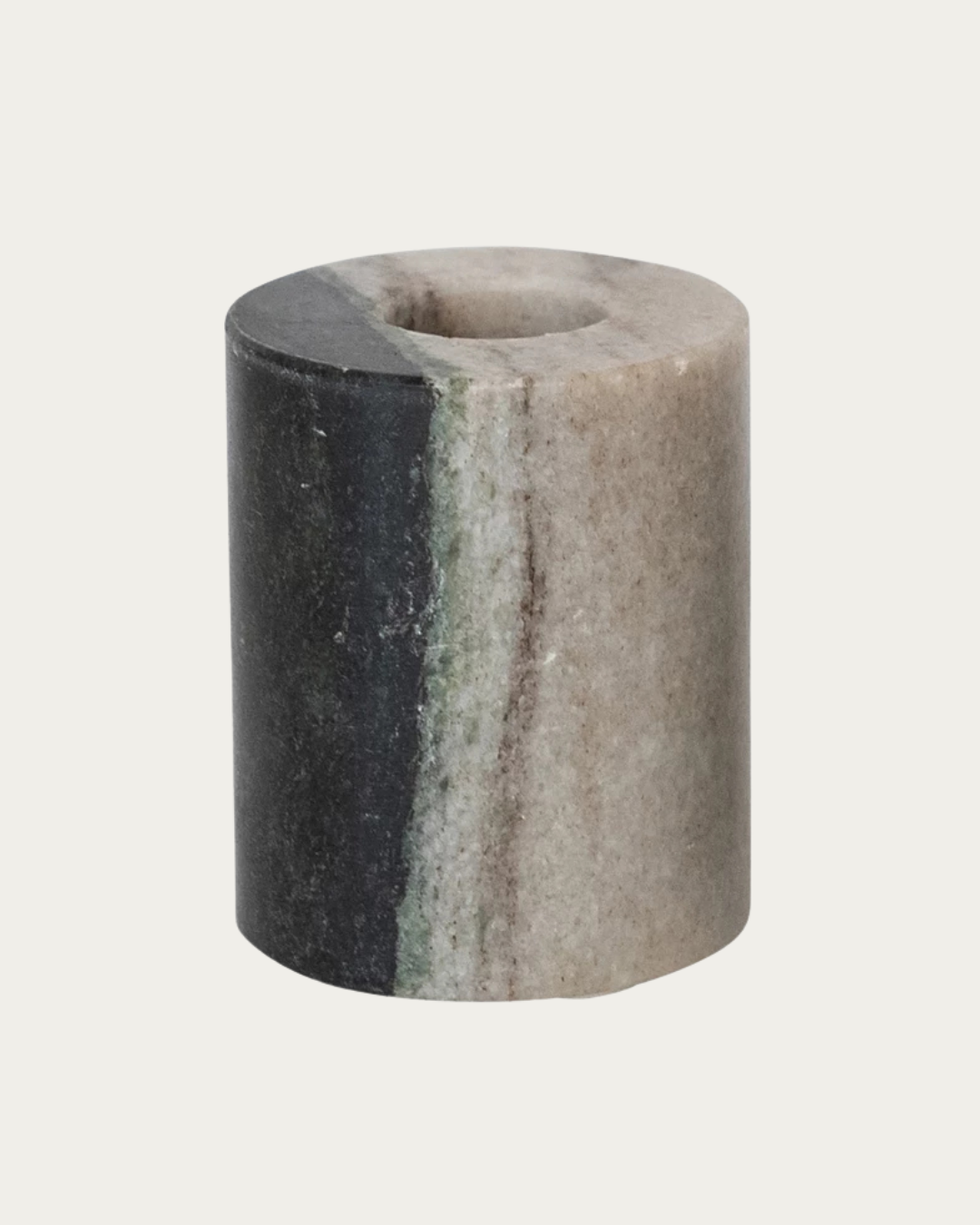 Marble cylindrical candle holder with gray and black stripes on a light gray background