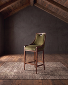 living room custom furniture modern mountain velvet bar stool Hello Norden - Rurik Bar Stool in Banks Eco-Performance Velvet in Olive, shown in a rustic modern room