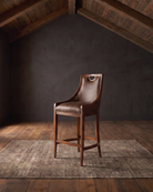 living room custom furniture modern mountain leather bar stool Hello Norden - Rurik Bar Stool in St. Croix Holm Sweet Holm Leather, shown in a rustic modern room