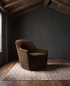 living room custom furniture modern mountain velvet chair Hello Norden - Signe Swivel Chair in Banks Eco-Performance Velvet in Cognac, shown in a rustic modern room