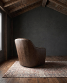 living room custom furniture modern mountain leather chair Hello Norden - Signe Swivel Chair in St Croix Holm Sweet Holm leather, shown in a rustic modern room