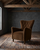 living room custom furniture modern mountain velvet chair Hello Norden - Soren Wing Chair in Banks Eco-Performance Velvet in Cognac, shown in a rustic modern room