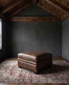 living room custom furniture modern mountain leather ottoman Hello Norden - Tyler Ottoman in St Croix Holm Sweet Holm leather, shown in a rustic modern room